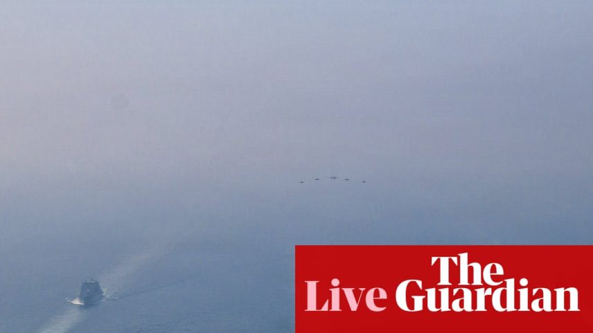 US warships sail in formation in the Arabian Sea