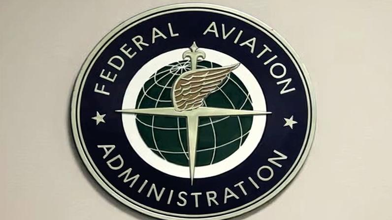 A Federal Aviation Administration sign hangs in the tower at John F Kennedy international airport in New York, on 16 March 2017.