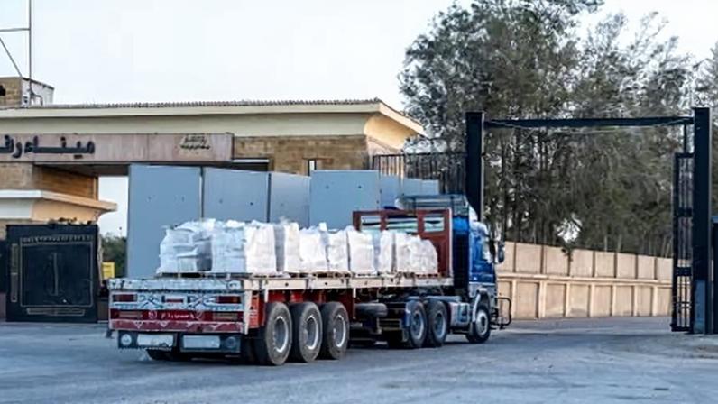 A truck carrying humanitarian aid waits to enter Gaza from the Egyptian side of the Rafah border crossing.