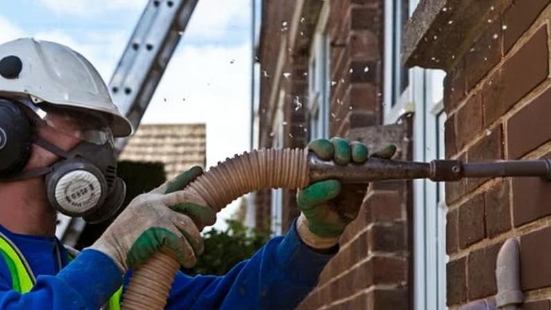 Cavity wall insulation being installed in a home in West Yorkshire.