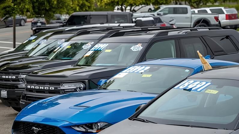Used cars at a dealership in Colma, California.