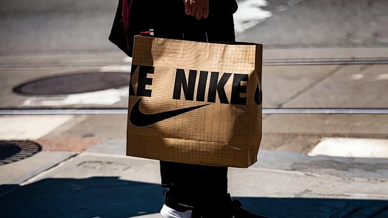 A shopper carries a Nike bag in downtown Detroit, Michigan, on 7 June 2025.