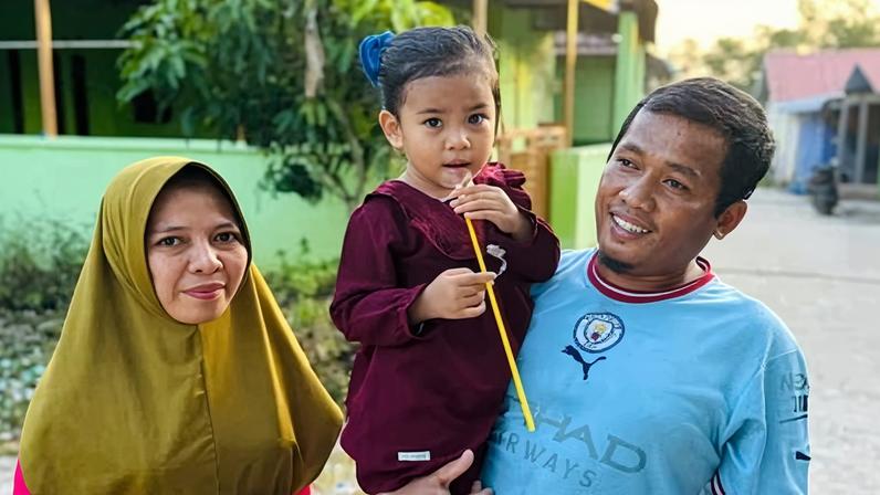 Indonesian man Anto with his wife and daughter. At the age of 15 Anto was wrongfully imprisoned in Australia as an adult people smuggler