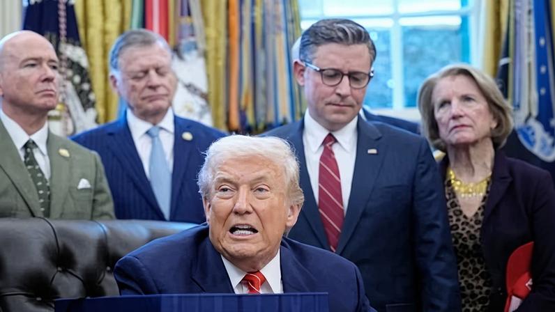 Donald Trump pictured yesterday signing a bill to end the partial government shutdown