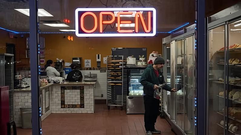 A customer browses baked goods at Panaderia San Miguel in Minneapolis, Minnesota. The bakery closed for three weeks due to federal activity in the area.