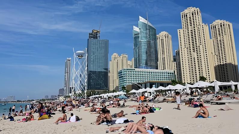 People on the beach in the area of the Jumeirah Beach residence in Dubai