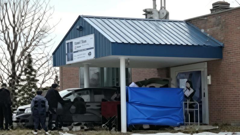 People work at the high school where a deadly mass shooting took place, in the town of Tumbler Ridge, British Columbia, Canada.