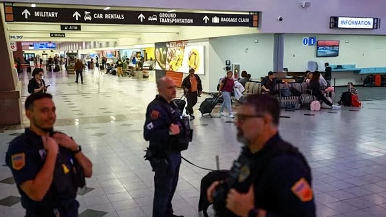 Security officials at El Paso airport after the FAA abruptly lifted its 10-day closure.