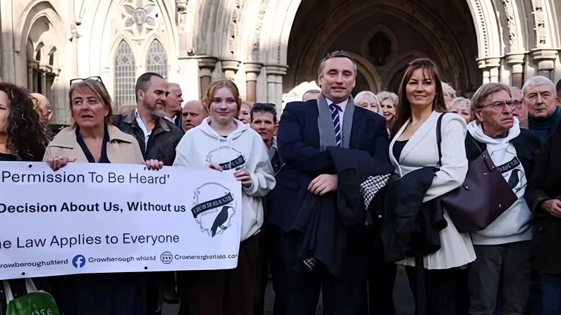 Crowborough Shield's director and supporters outside the high court in London.