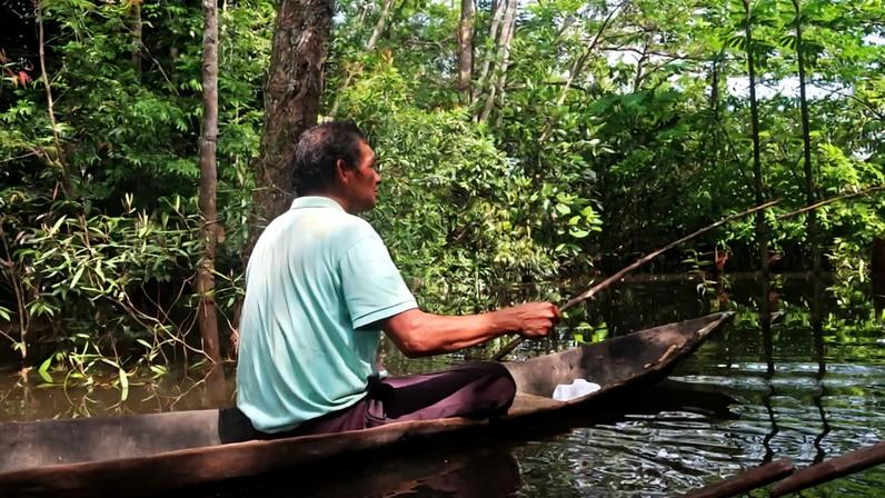 Harold Ferreira Romero, a fisher from the Indigenous Macaquiño community in Vaupés, fishes in a lagoon that is considered sacred to the community.