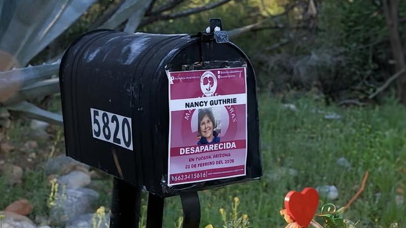 A missing flyer for Nancy Guthrie is taped to the 84-year-old’s mailbox in Tucson, Arizona.