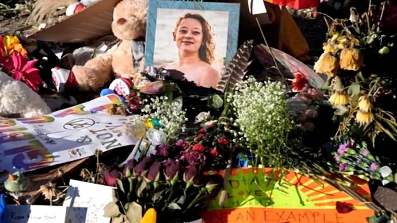 Flowers and photos at a memorial site for Renee Good, on 31 January in Minneapolis, Minnesota.