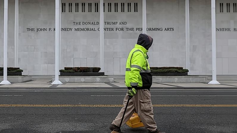 A worker walks in front of the Kennedy Center in Washington DC on 29 December 2025.