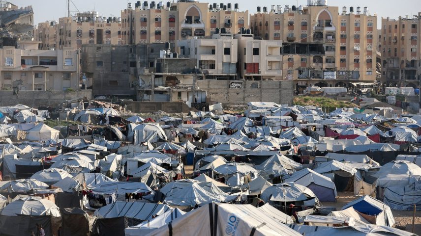 Palestinians displaced during the two-year Israeli offensive shelter at a tent camp in Khan Younis in the southern Gaza Strip, February 10, 2026.
