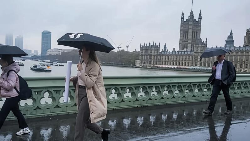 Pedestrians on Westminster Bridge. South-east England received nearly a third of its average February rainfall in the first three days of the month.