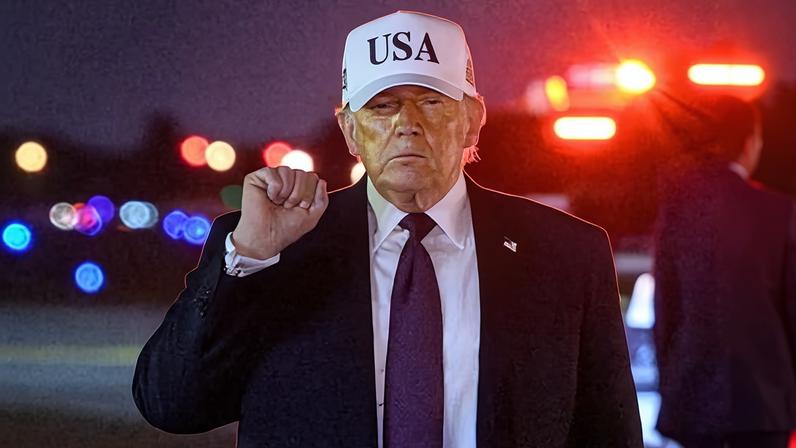 Donald Trump gestures as he arrives at Palm Beach international airport Florida on 27 February.