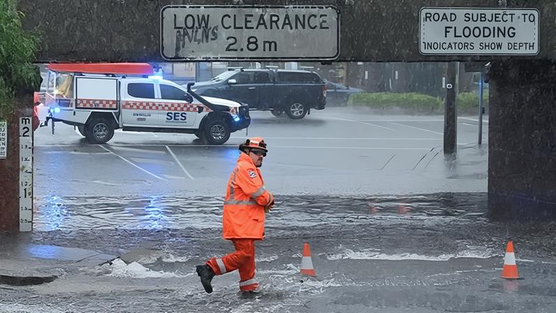SES personnel at a flooded underpass in South Melbourne. Parts of Victoria received more than double their average February rainfall overnight.