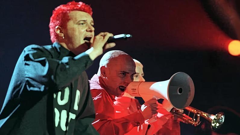 Chumbawamba perform Tubthumping at the start of the 1999 Brit Awards ceremony in London.