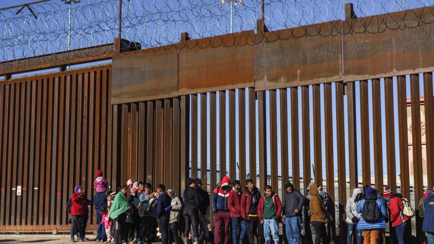 Migrants from Nicaragua, Ecuador and other nationalities are pictured at a door on the border wall waiting to be picked up by the United States Border Patrol in El Paso, Texas, U.S., January 4, 2023. REUTERS/Paul Ratje