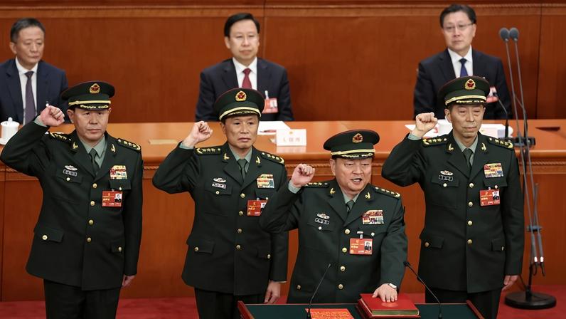 Then vice chairman of the Central Military Commission of the People's Republic of China Zhang Youxia (front), swears an oath with members of the Central Military Commission after they were appointed during the opening of the fourth plenary session of the National People's Congress on March 11, 2023 in Beijing, China.