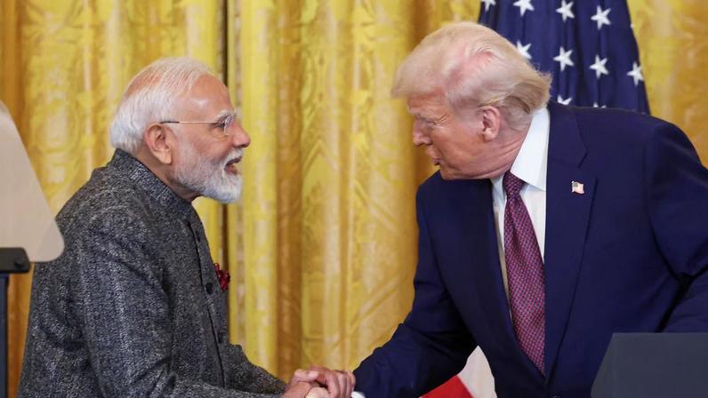 U.S. President Donald Trump and Indian Prime Minister Narendra Modi shake hands as they attend a joint press conference at the White House in Washington, D.C., U.S., February 13, 2025. REUTERS/Kevin Lamarque/File Photo