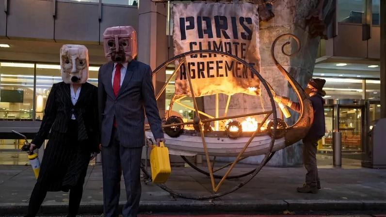 Activists set fire to a “viking ship” outside the National Maritime Organization in London on Nov. 15, 2020.