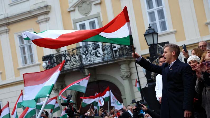 Peter Magyar, leader of the opposition TISZA party, waves a flag during a campaign tour in Gyor, Hungary, November 15, 2025.