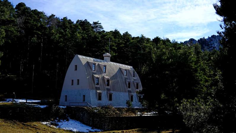 A visitor walks around of Xalet del Catllaras - a three-storey mountain shelter built for workers at a cement factory located 125 km (78 miles) north of Barcelona, Spain, February 18, 2026. REUTERS/Nacho Doce