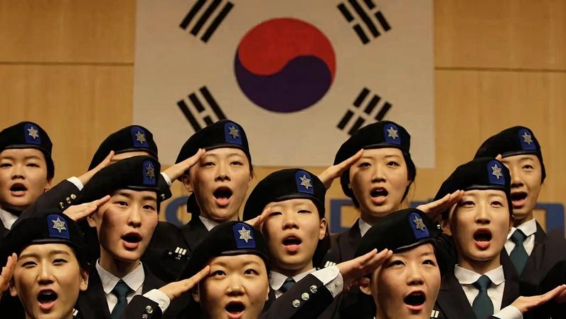 South Korean university students salute during an establishment ceremony of the Reserve Officer Training Corps (ROTC) for female cadets at Sookmyung Women's University on December 10, 2010 in Seoul.