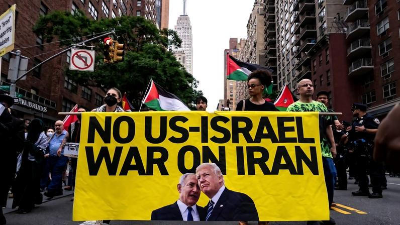 People march during a rally calling for the Trump administration not to go to war with Iran, in New York City.