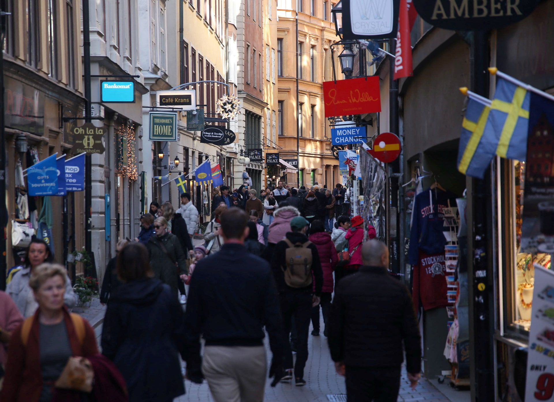 Pedestrians walk along a street in the Old Town of Stockholm, Sweden, October 17, 2024. REUTERS/ Tom Little/File Photo