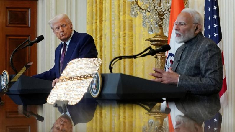 FILE PHOTO: U.S. President Donald Trump and Indian Prime Minister Narendra Modi in Washington, D.C., February 13, 2025. REUTERS/Nathan Howard