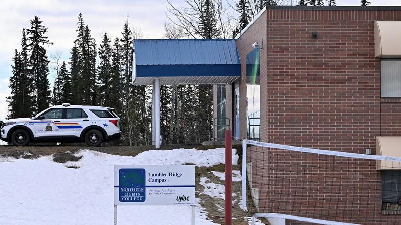 A police vehicle is parked outside a high school, the site of a deadly mass shooting in the town of Tumbler Ridge, British Columbia, Canada February 11, 2026. REUTERS/Jennifer Gauthier