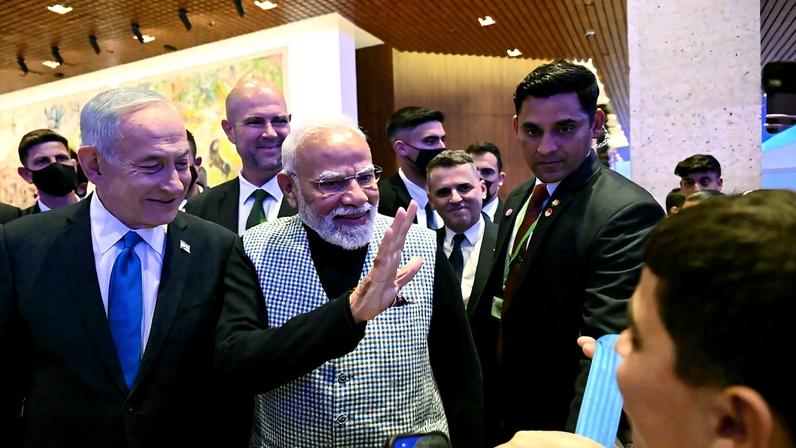Israeli Prime Minister Benjamin Netanyahu and Indian Prime Minister Narendra Modi greet children in the Knesset in Jerusalem on Feb. 25.