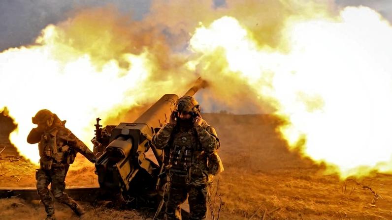 Ukrainian servicemen firing a D-30 howitzer at Russian positions near Bakhmut, eastern Ukraine, on March 21, 2023.
