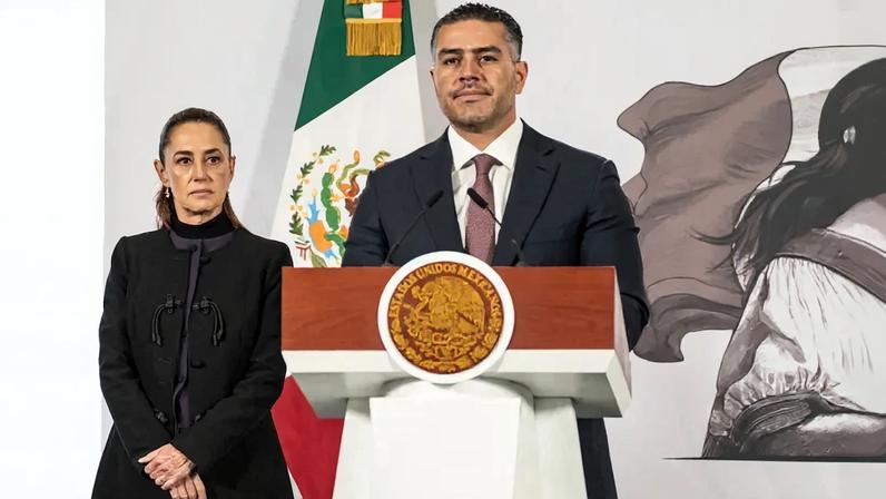 Mexican Secretary of Security and Citizen Protection Omar García Harfuch speaks while Mexican President Claudia Sheinbaum looks on during her daily morning briefing at the National Palace in Mexico City.