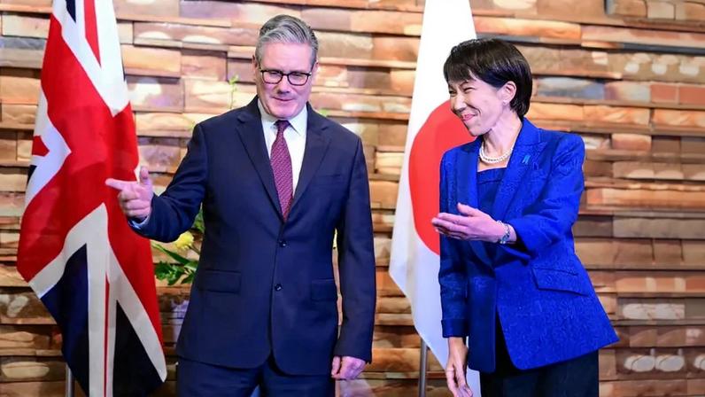 Japanese Prime Minister Sanae Takaichi greets British Prime Minister Keir Starmer ahead of a bilateral meeting in Tokyo on Jan. 31.