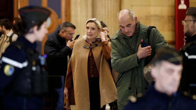 French far-right leader Marine Le Pen, member of parliament for the Rassemblement National (National Rally - RN) party, leaves a hearing during which civil parties will be heard and prosecutors will present their sentencing request in her appeal trial, alongside the RN party itself and 10 others defendants found guilty of diverting European Parliament funds, at the Paris courthouse on the Ile de la Cite, in Paris, France.