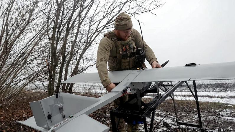 Ukrainian servicemen operate a Darts strike drone at their position near a front line in Donetsk region