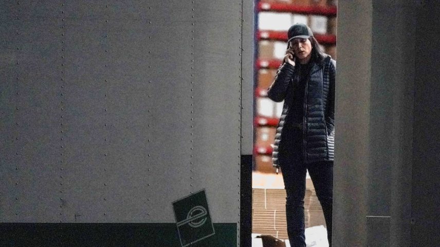 United States Director of National Intelligence Tulsi Gabbard speaks on the phone while standing at the edge of a truck loading bay after the Federal Bureau of Investigation (FBI) executed a search warrant for the Fulton County Election Hub and Operation Center in relation to the 2020 election, according to a law enforcement official familiar with the matter, in Union City, Georgia, U.S. January 28, 2026. REUTERS/Elijah Nouvelage.