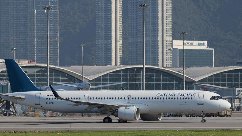 A Cathay Pacific aircraft taxis at Hong Kong International Airport on the day of the official launch of its third runway, in Hong Kong, China November 28, 2024. REUTERS/Tyrone Siu/File Photo