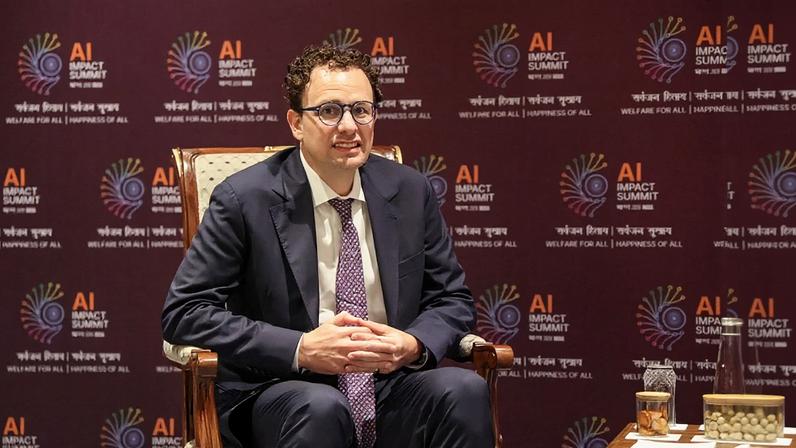 Anthropic CEO Dario Amodei looks on during a meeting with France's President Emmanuel Macron on the sidelines of the AI Impact Summit in New Delhi, India on Feb. 19.
