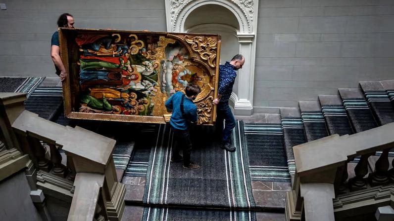 Workers move the Annunciation to the Blessed Virgin of the Bohorodchany Iconostasis in the Andrey Sheptytsky National Museum, Lviv, on 4 March 2022, as part of safety preparations