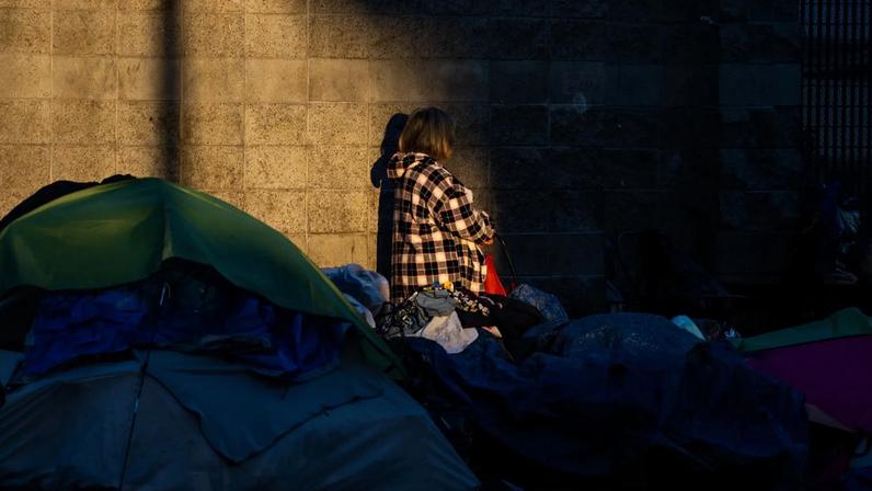 Homeless people and tents on a sidewalk in Los Angeles, California on July 24, 2025.