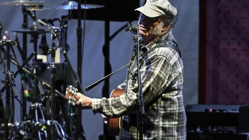 Neil Young performing onstage