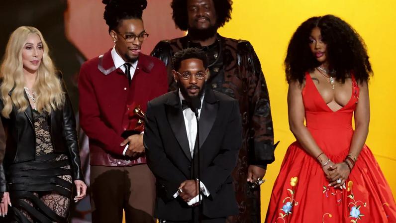 Kendrick Lamar accepting the Record of the Year Grammy Award
