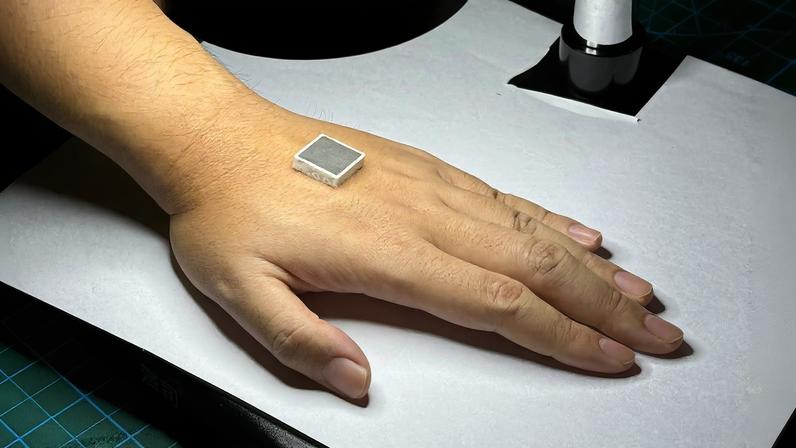 A customized patch developed by WITEC, shown here in prototype, is made with ultrasonic transducers that adhere to the human body using bioadhesive gel soft materials.