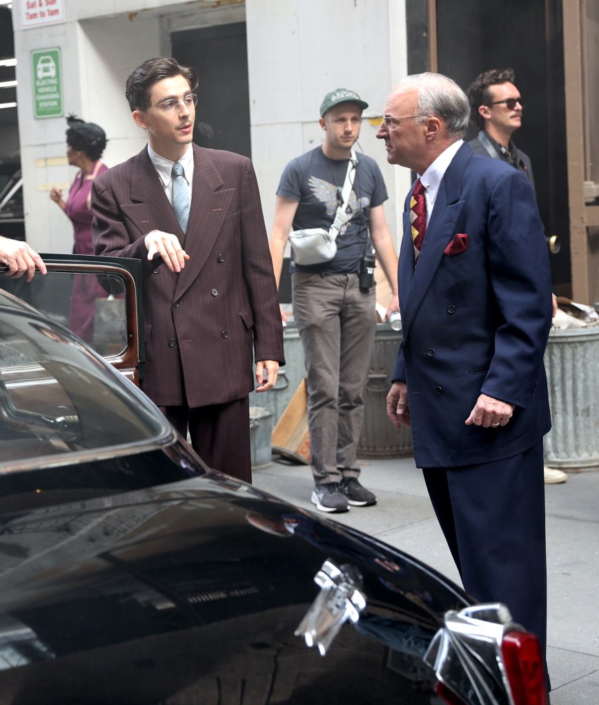 Timothée Chalamet appears to be giving an homage to the style of his “Marty Supreme” character on the red carpet, sporting suits in a similar double-breasted style.