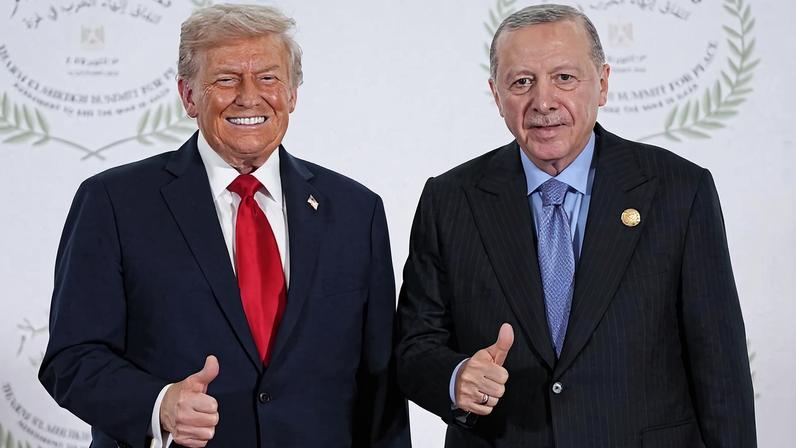 US President Donald Trump and Turkish President Recep Tayyip Erdogan pose for a photo during a summit on Gaza in Sharm el-Sheikh on October 13, 2025.