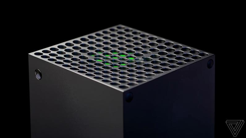 The upper part of the Xbox Series X placed against a black background.